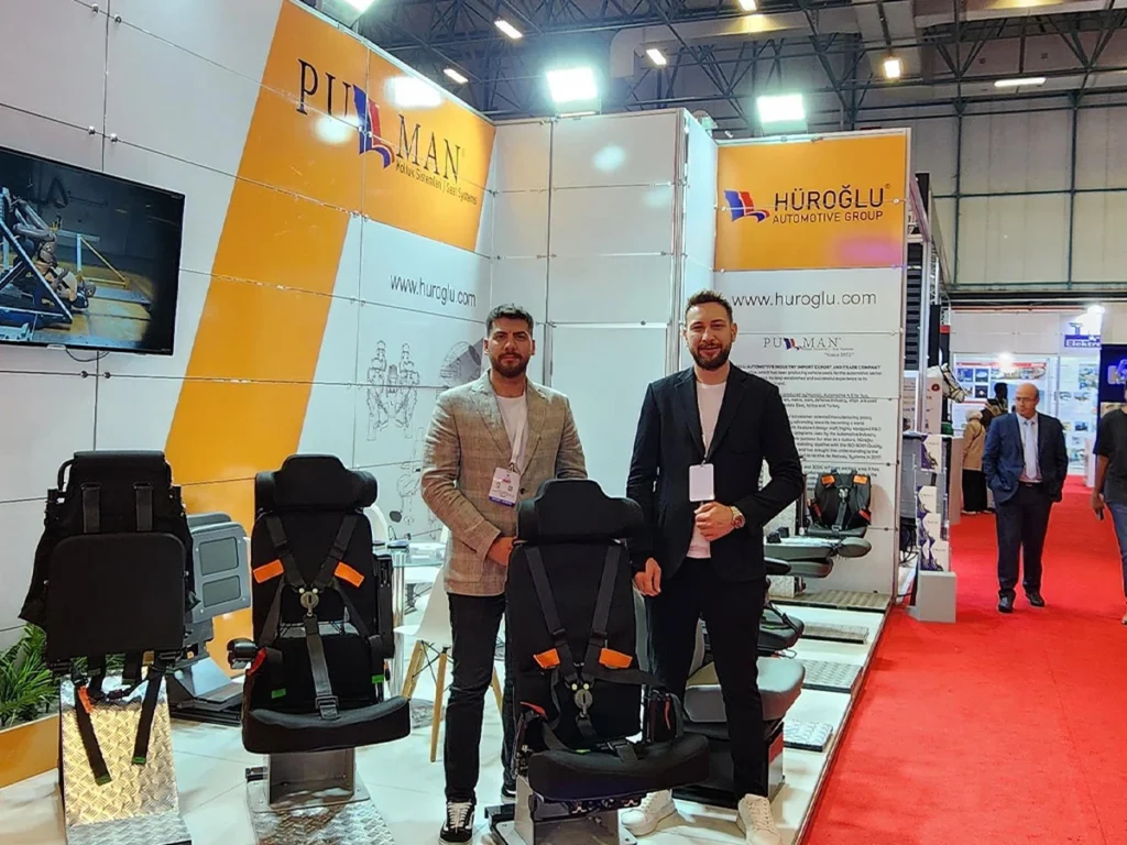 MRAP Armored vehicle seats and company representatives at the Pullman Seats stand at IDEF 2023