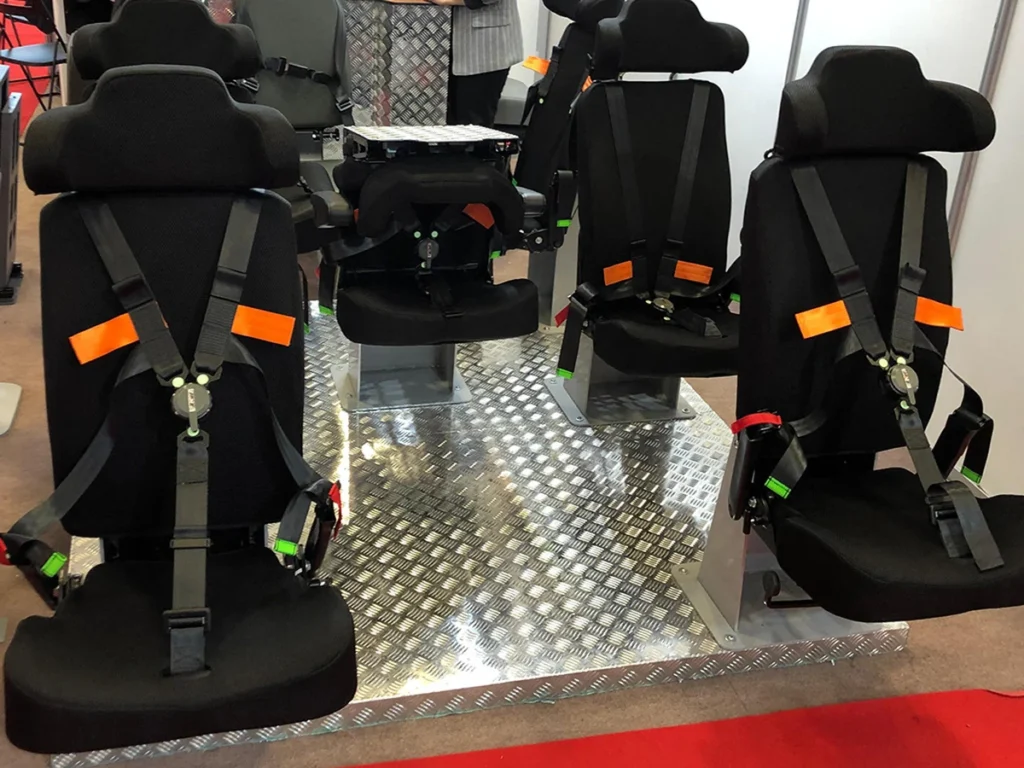 Armored vehicle seats with harnesses displayed at the Pullman Seats stand at IDEF 2019
